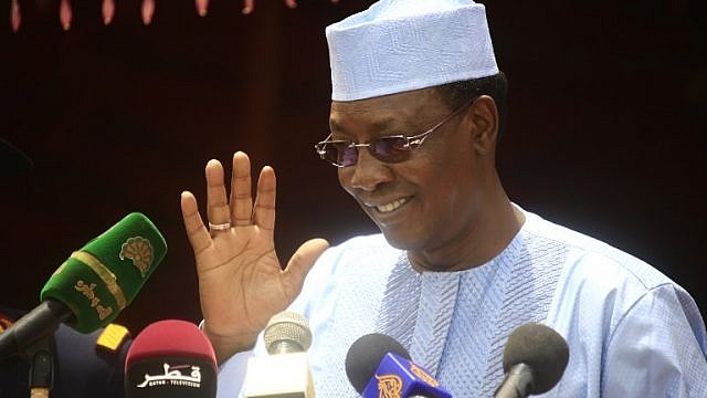 Chadian President Idriss Deby waves on stage during a ceremony to declare an end to 13 years of conflict in Darfur on September 7, 2016 in the North Darfur state capital El-Fasher. - Khartoum has repeatedly sought to declare an end to the conflict in Darfur this year, claiming that an April referendum backing the current five-state division of the region turned the page. (Photo by ASHRAF SHAZLY / AFP)